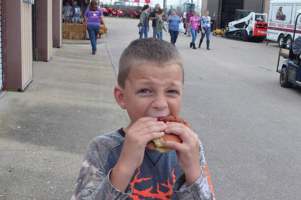 128860952_web1_owen-craig-copy
A photo of Owen Craig enjoying a Brown County Pork Producers’ pork tenderloin sandwich during the 2018 Brown County Fair. Photo by Wade Linville