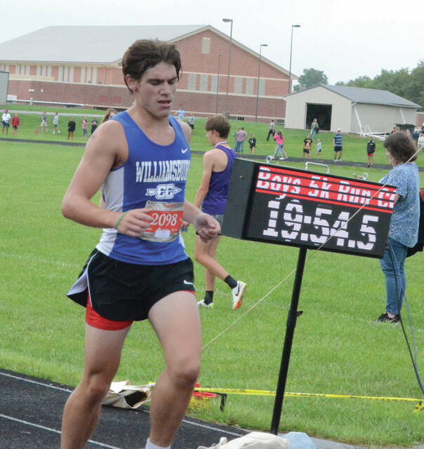 Williamsburgs Alex Boland crosses the finish line at this years Vern Hawkins Cross Country Invitational held at Georgetown Sept. 9. Photo by Wade Linville