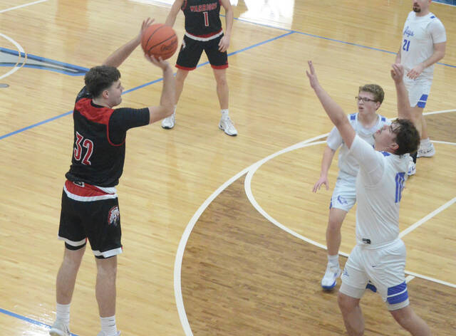 Easterns Braxton Vance fires off a shot from three-point range during the Warriors Feb. 19 win at Ripley. Photo by Wade Linville