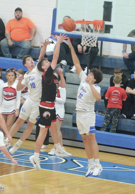 Easterns Chase Pinkerton goes up for a shot over Ripley defenders during the Warriors Feb. 19 win. Photo by Wade Linville